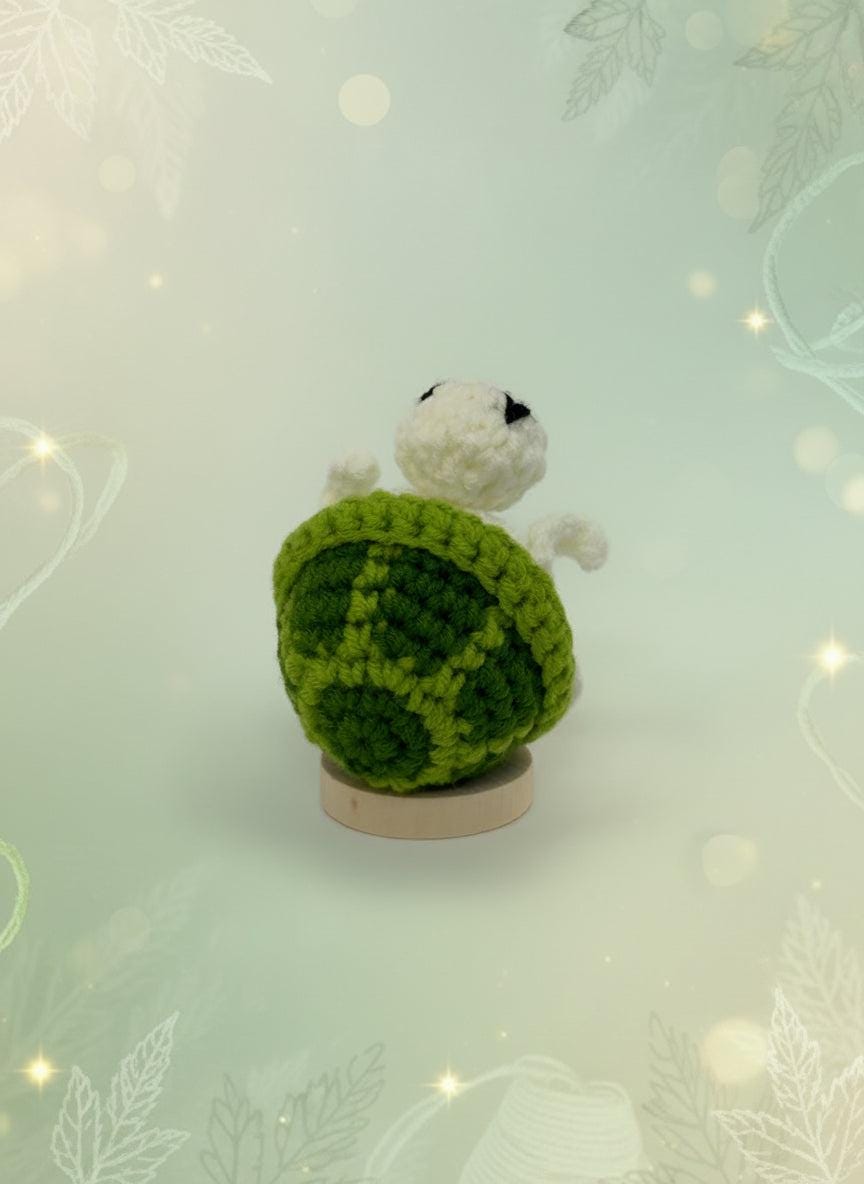 Crochet turtle plushie by Craft-N-Crumble™, showcasing its adorable handmade design and cozy texture.