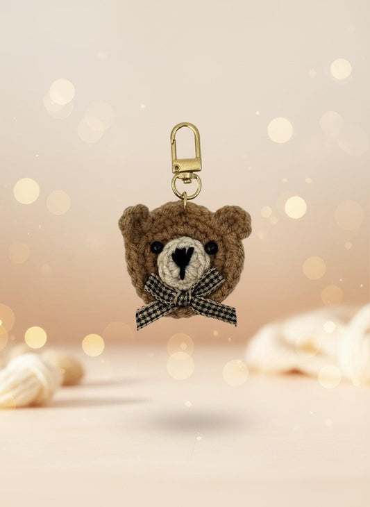 Crocheted bear keychain with a bow