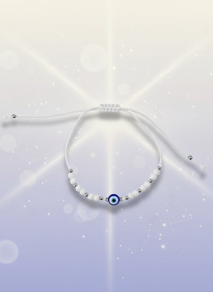 Yellow beaded bracelet on a white background with a brown card