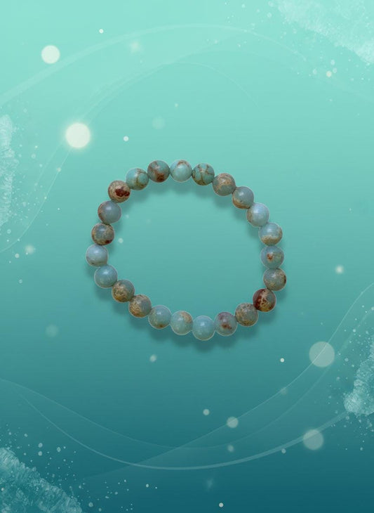 Beaded bracelet on a cardboard holder against a white background