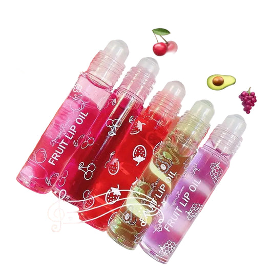 Four colorful fruit lip oil bottles with fruity designs, offering hydration and shine for soft, smooth lips.