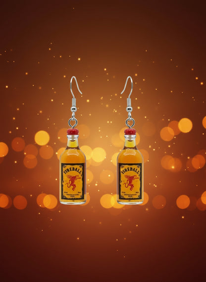 Fireball bottle-shaped earrings on a black card with a wooden stand.