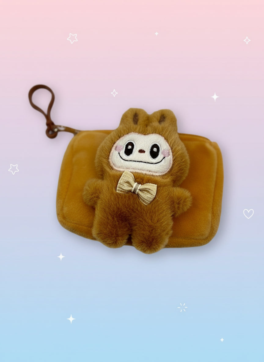 Brown plush toy with a bow tie on a white background