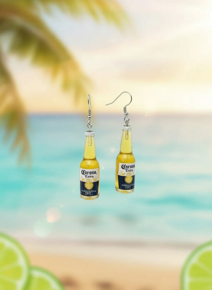 Beer bottle-shaped earrings on a display card with a white background