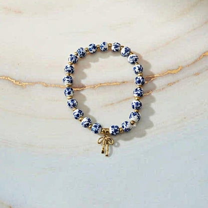 Blue and White Porcelain Beaded Bracelet with Red Bow Charm