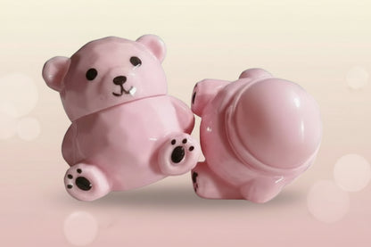 Bear Magic Lip Balm in a cute pink bear-shaped container, offering color-changing lip gloss that adapts to you.