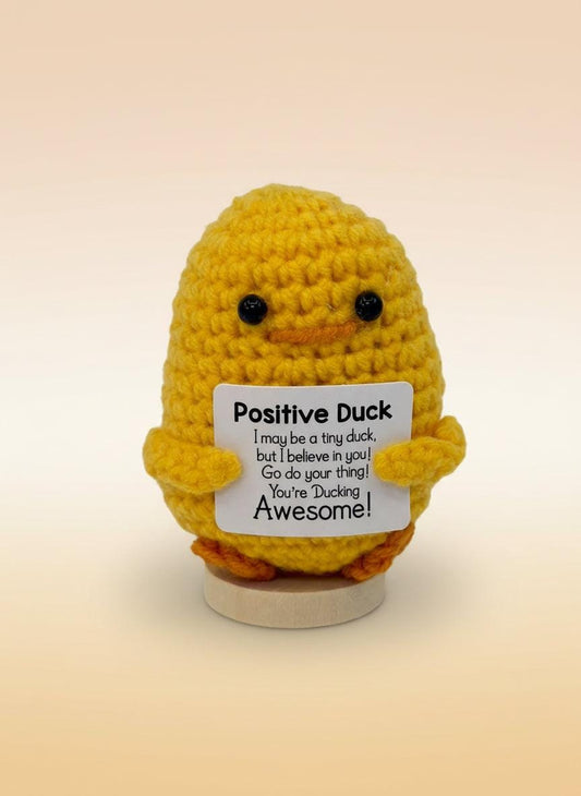 Emotional support duck plushie with sign promoting positivity and encouragement in a cheerful yellow color.