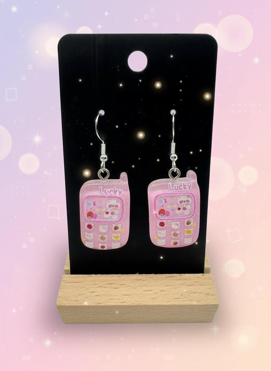 Adorable Kawaii Phone Earrings featuring cute pink resin mini phone designs with a charming cartoon style.