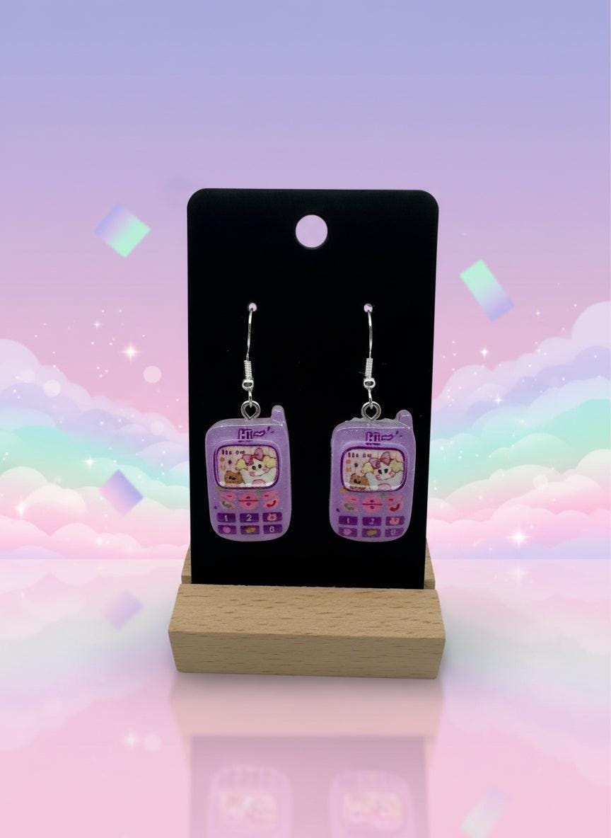 Adorable Kawaii Phone Earrings in purple resin, featuring cute cartoon phone designs for a playful accessory.