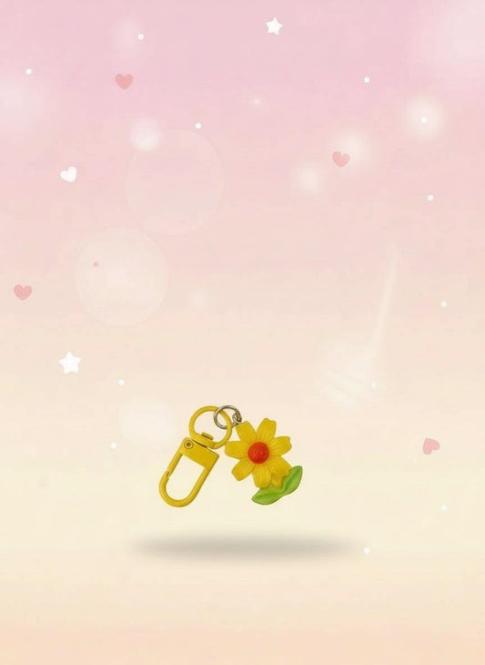 Floral keychain in clear packaging with &#39;Sweetie&#39; label on red backing