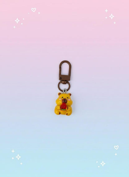 Keychain in clear packaging with &#39;Sweetie&#39; label on pink background