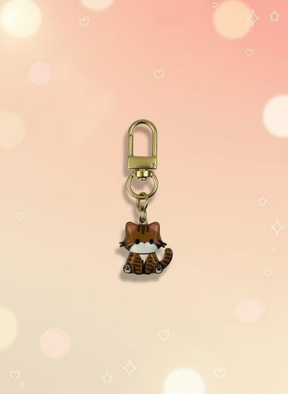 Small keychain with a gold clasp on a light gray background