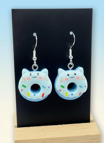 Cute Animal Donut Earrings in blue resin with cat faces and sprinkles, perfect kawaii charm jewelry.