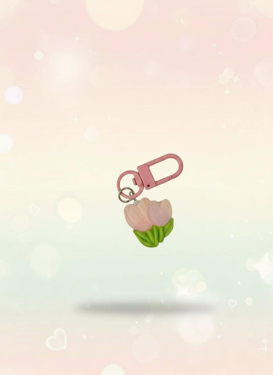 Pink keychain with a small bag on a clear plastic card, attached to a red tag with &#39;Sweetie&#39; text.