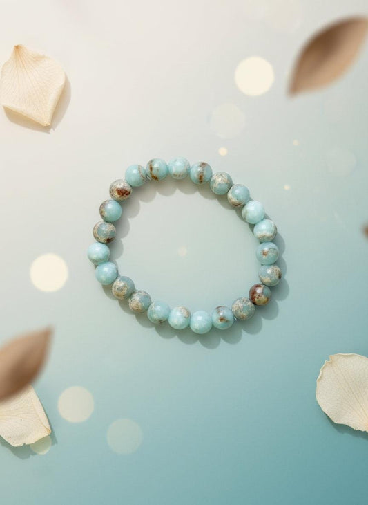 Beaded bracelet on a white background with a brown cardboard holder