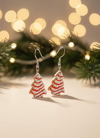Christmas tree-shaped earrings with a festive background